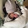 Eden participe au concours pour gagner de l'argent avec cette photo : baby, blanket, child, clothing, cozy, cushion, hand, hat, indoor, infant, pattern, pillow, remote_control, rest, seat, sleeping, sleeve, soft, wooden_table, wrapped