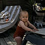 Elie participe au concours pour gagner de l'argent avec cette photo : baby, baby_girl, backyard, barefoot, casual, child, curious, daylight, expression, furniture, lounge_chair, outdoor, person, playful, romper, standing, summer, sun_lounger, wooden_deck, young_child