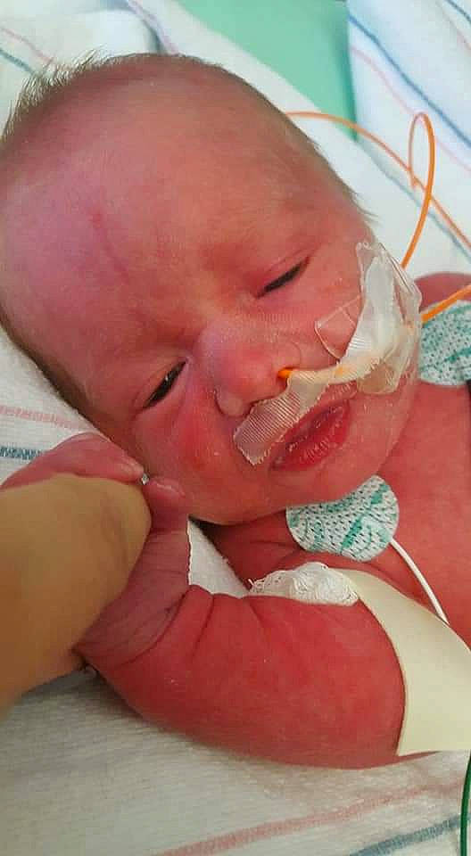 Karter is registered to the contest to win money with this photo: baby, birth, cheek, child, childbirth, face, hand, head, lip, mouth, nose, person, skin, sorrow, toddler