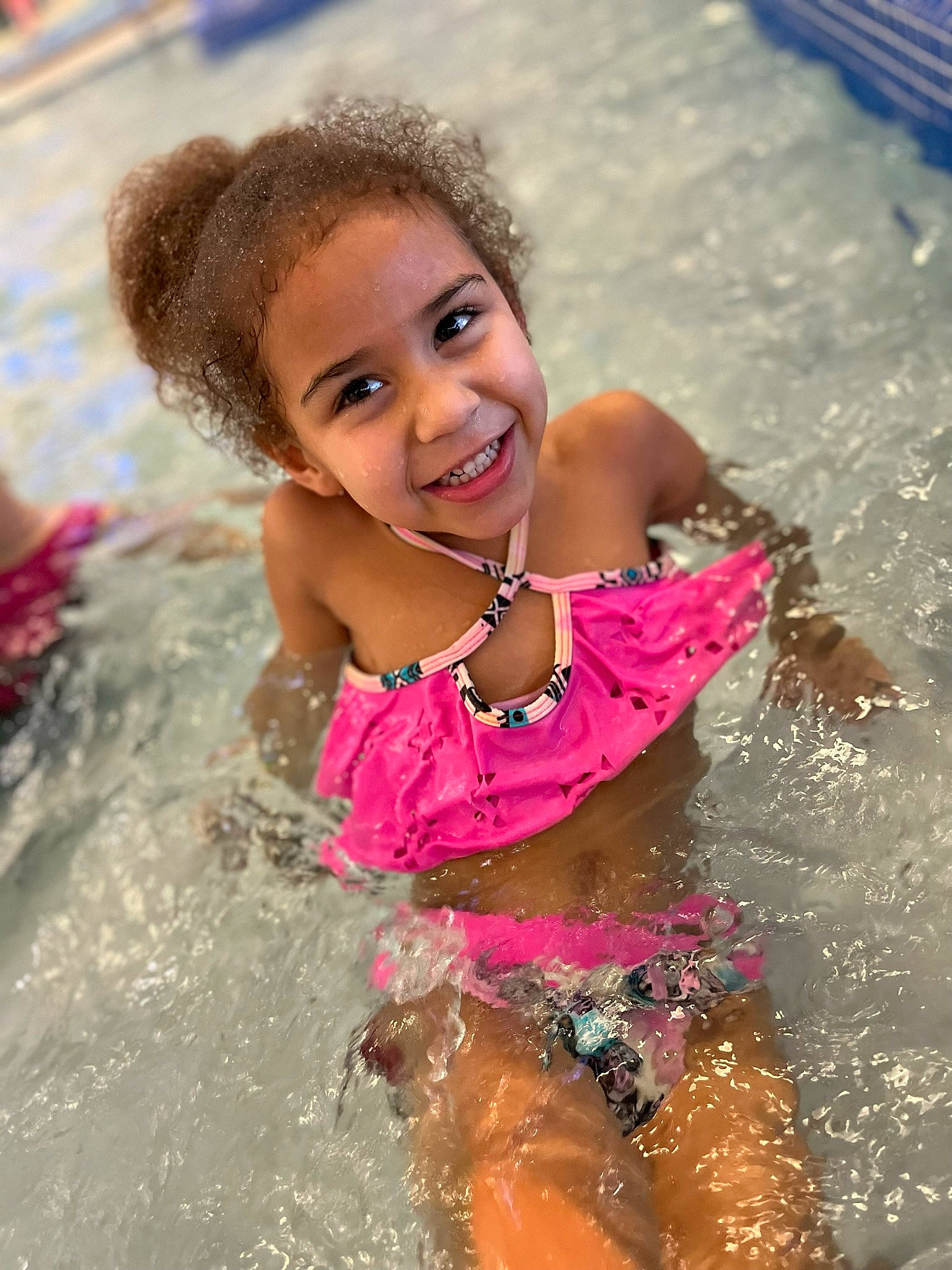 Kinley joined the competition — help win amazing prizes! bathing, body_of_water, eye, face, fun, happy, head, headgear, human_body, joy, leisure, person, personal_protective_equipment, pink, recreation, skin, smile, swimming_pool, swimwear, thigh