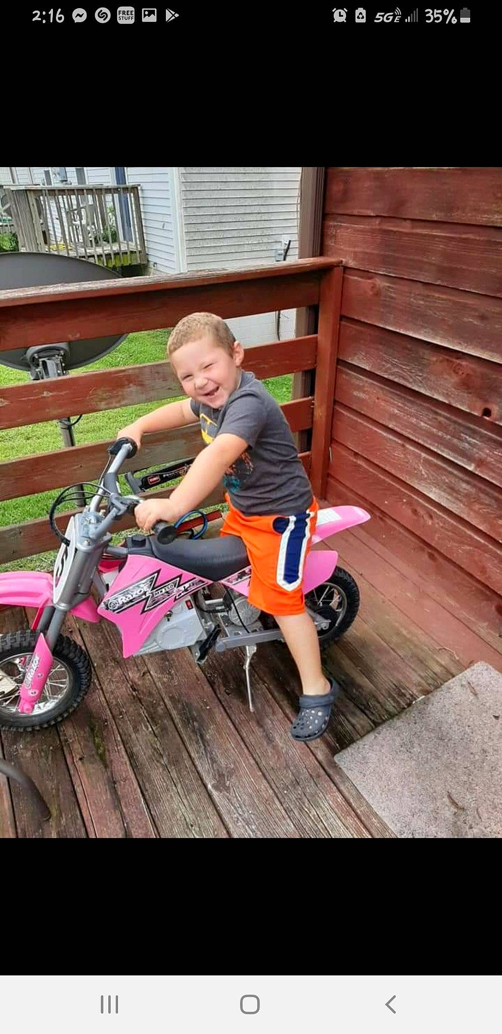 Quintin joined the competition — help win amazing prizes! bicycle_accessory, bicycle_frame, bicycle_tire, child, grass, happy, hardwood, joy, leisure, magenta, person, recreation, shoe, shorts, sitting, smile, sneakers, tire, toddler, vehicle