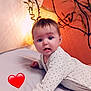 Shelsea a rejoint le concours — aidez-le/la à gagner de superbes lots ! baby, infant, bed, onesie, polka_dot, face, hand, plant, lamp, light, red_heart_emoji, indoor, curious, lying_down, skin, child, young, portrait, expression, cozy