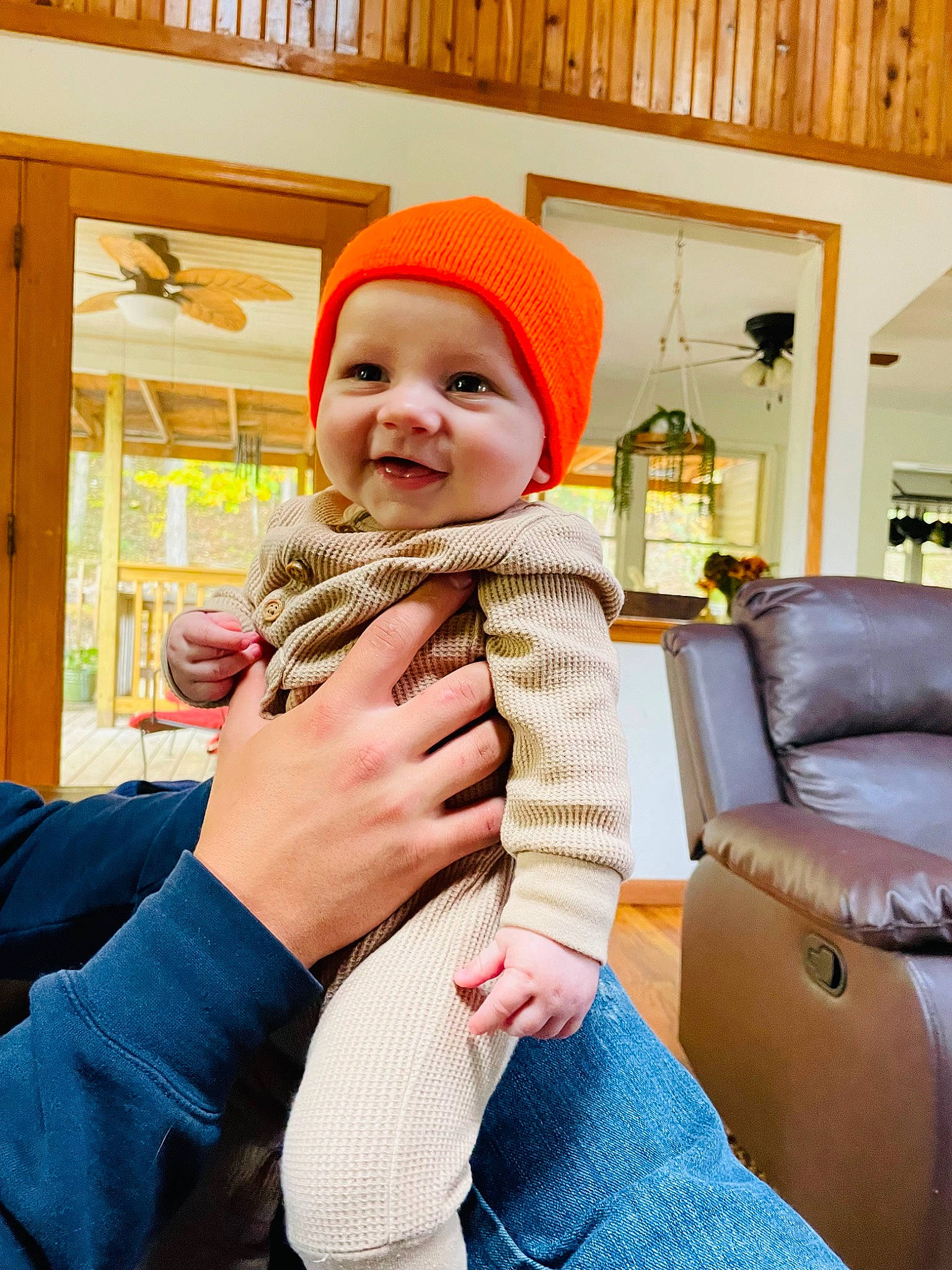 Lincoln is registered to the contest to win money with this photo: baby, baby_products, baby_toddler_clothing, child, comfort, happy, headwear, human_body, human_leg, joy, knee, lap, linens, outerwear, person, pillow, room, shelf, sitting, smile