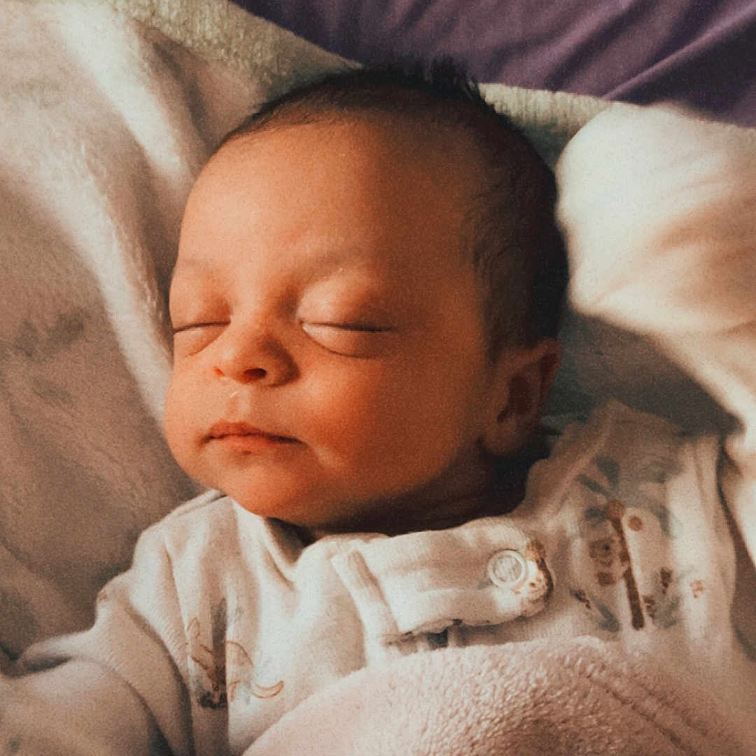 Loki joined the competition — help win amazing prizes! newborn, baby, sleeping, blanket, bed, cozy, soft, face, infant, child, peaceful, indoors, warm_lighting, purple, clothing, rest, comfort, portrait, cute, relaxation
