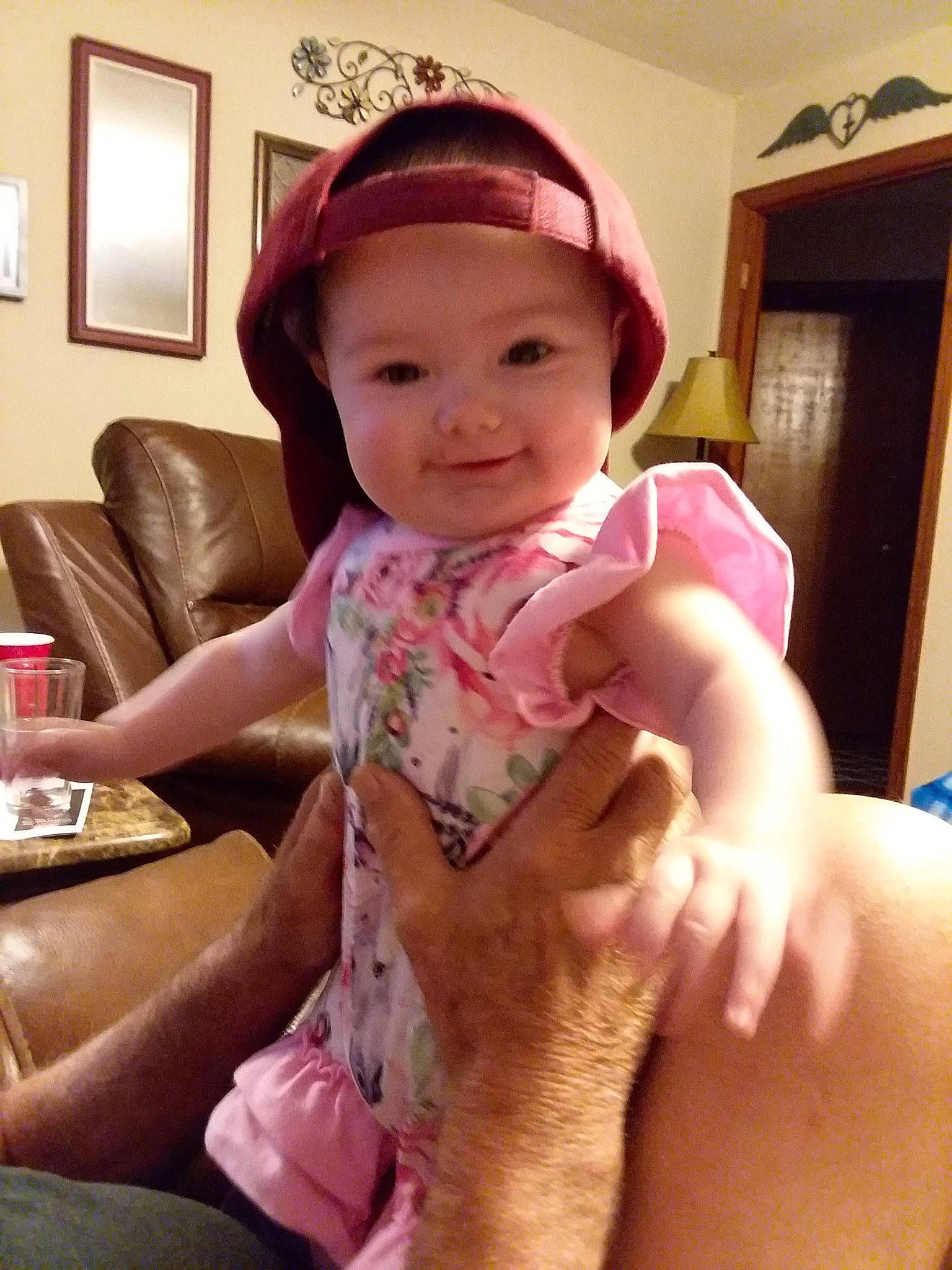 Lumi is registered to the contest to win money with this photo: arm, cheek, child, finger, hand, head, leg, neck, person, pink, skin, smile, thumb, toddler