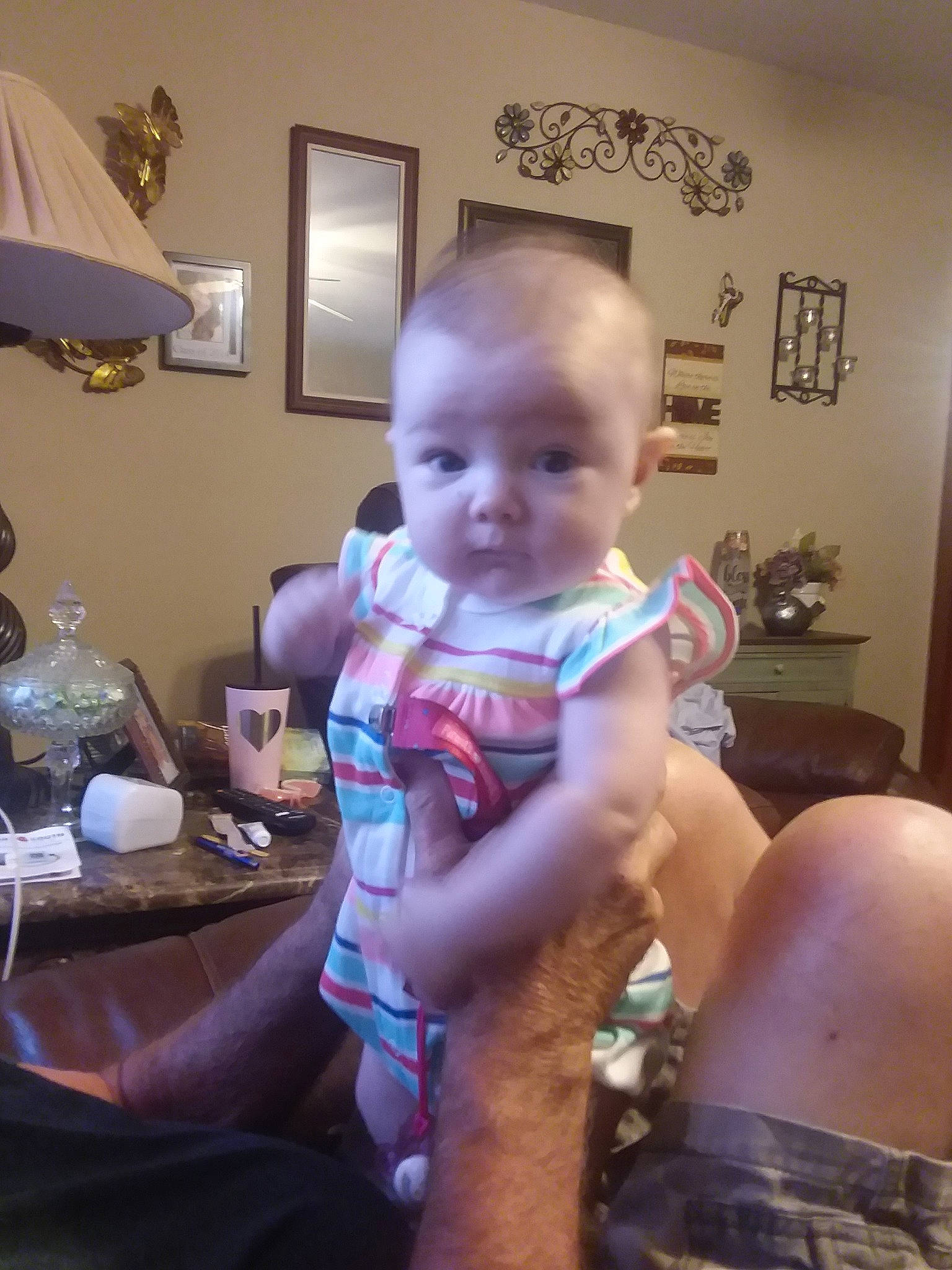 Lumi is registered to the contest to win money with this photo: arm, baby, cheek, child, ear, electronic_device, finger, fun, head, leg, neck, person, sitting, skin, smile, technology, toddler