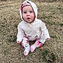 baby, child, hoodie, floral, pants, socks, grass, outdoor, curious, sitting, blue_eyes, fall_leaves, nature, young, cute, infant, expression, park, casual, seasonal