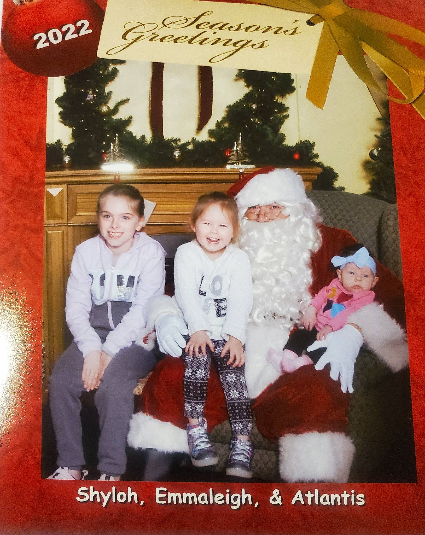 Atlantis joined the competition — help win amazing prizes! beard, child, christmas, christmas_decoration, christmas_eve, christmas_ornament, event, fun, happy, headwear, holiday, joy, lap, mammal, person, red, santa_claus, sleeve, smile, toddler