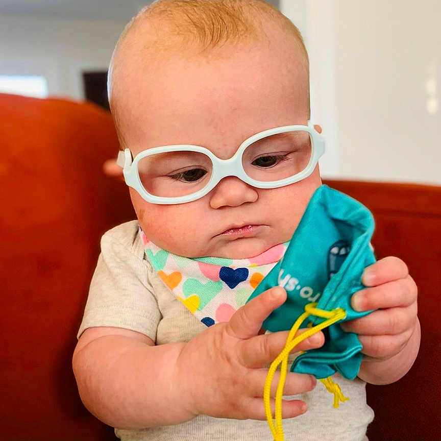 Joplin joined the competition — help win amazing prizes! accessories, baby, bodypart, clothing, couch, face, finger, furniture, glasses, glove, goggles, hand, head, indoors, interiordesign, person, photography, portrait, sunglasses, t_shirt