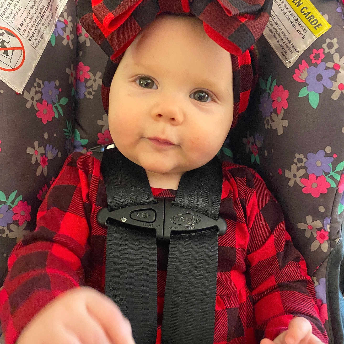 Wrenley is registered to the contest to win money with this photo: baby, bodypart, car, car_interior, carseat, clothing, coat, face, finger, gun, hand, hat, head, jacket, person, photography, portrait, transportation, vehicle, weapon