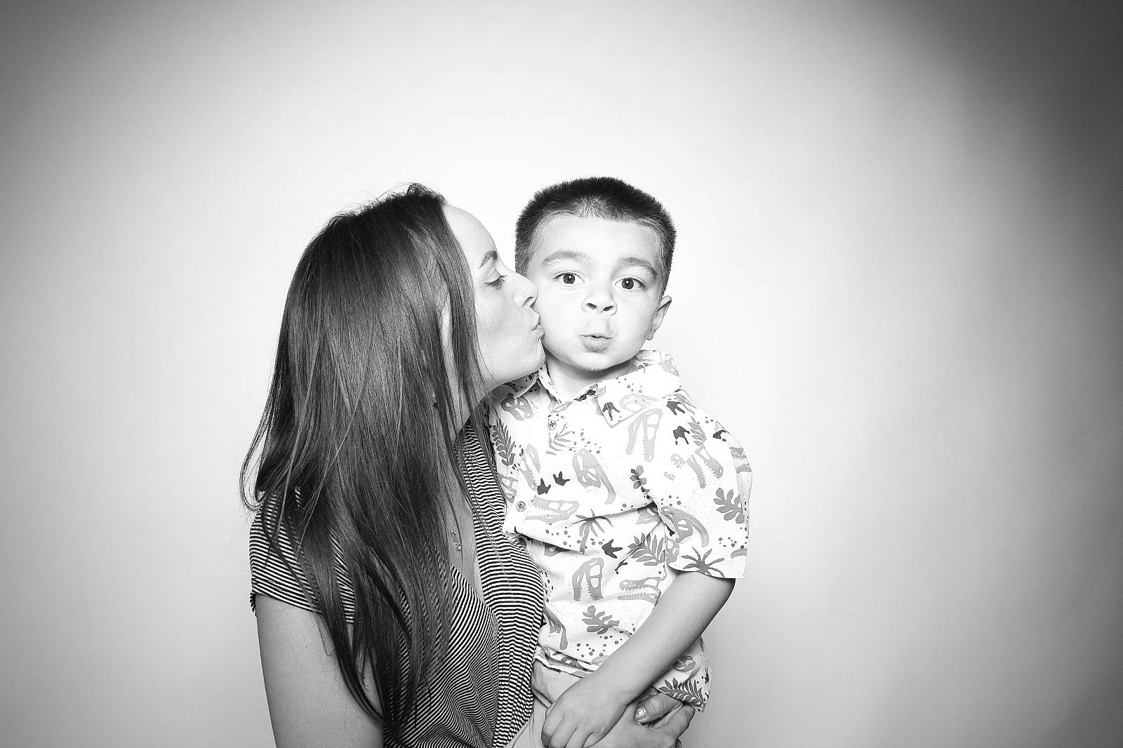 Sebastian is registered to the contest to win money with this photo: black_and_white, child, darkness, event, flash_photography, fun, gesture, grass, grey, happy, hug, love, monochrome, monochrome_photography, people_in_nature, person, romance, standing, stock_photography, style