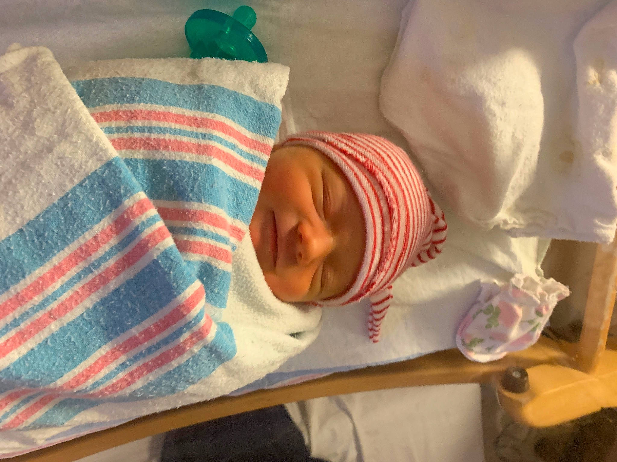 Bailey is registered to the contest to win money with this photo: baby, baby_products, baby_safety, baby_sleeping, baby_toddler_clothing, bedtime, child, comfort, hat, headgear, headwear, human_body, linens, nap, pattern, person, room, skin, tartan, textile