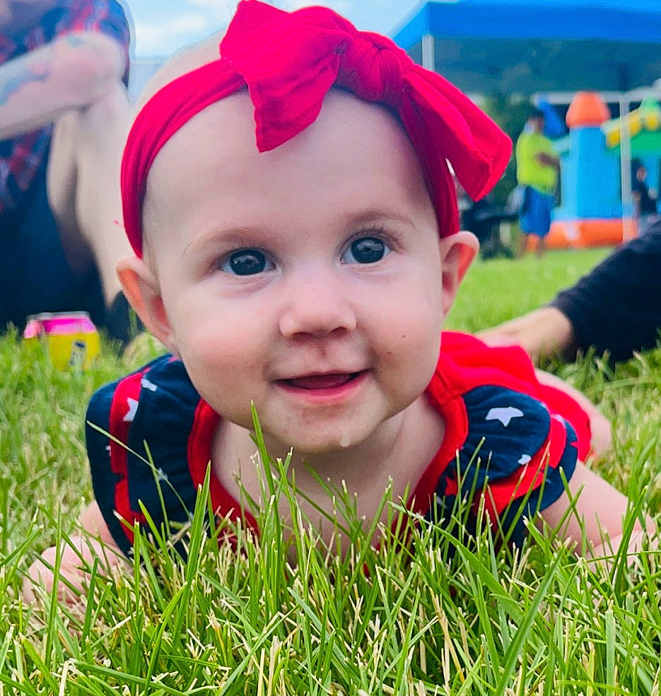 Lily joined the competition — help win amazing prizes! baby, chin, cool, facial_expression, fun, grass, happy, headwear, joy, leaf, leisure, lip, morning, people_in_nature, person, pink, plant, red, skin, smile