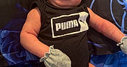 Lionel joined the competition — help win amazing prizes! arms, awake, baby, bed, black_and_blue, blanket, child, cute, face, indoor, infant, legs, lying_down, mittens, newborn, onesie, portrait, puma, sleeping, socks