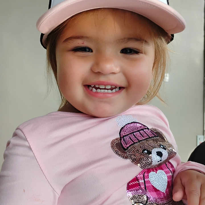 Alexia joined the competition — help win amazing prizes! cap, casual, child, clothing, cute, face, happy, hat, headwear, indoor, joyful, minnie_mouse, person, pink_shirt, portrait, sequins, smile, teddy_bear, toddler, young