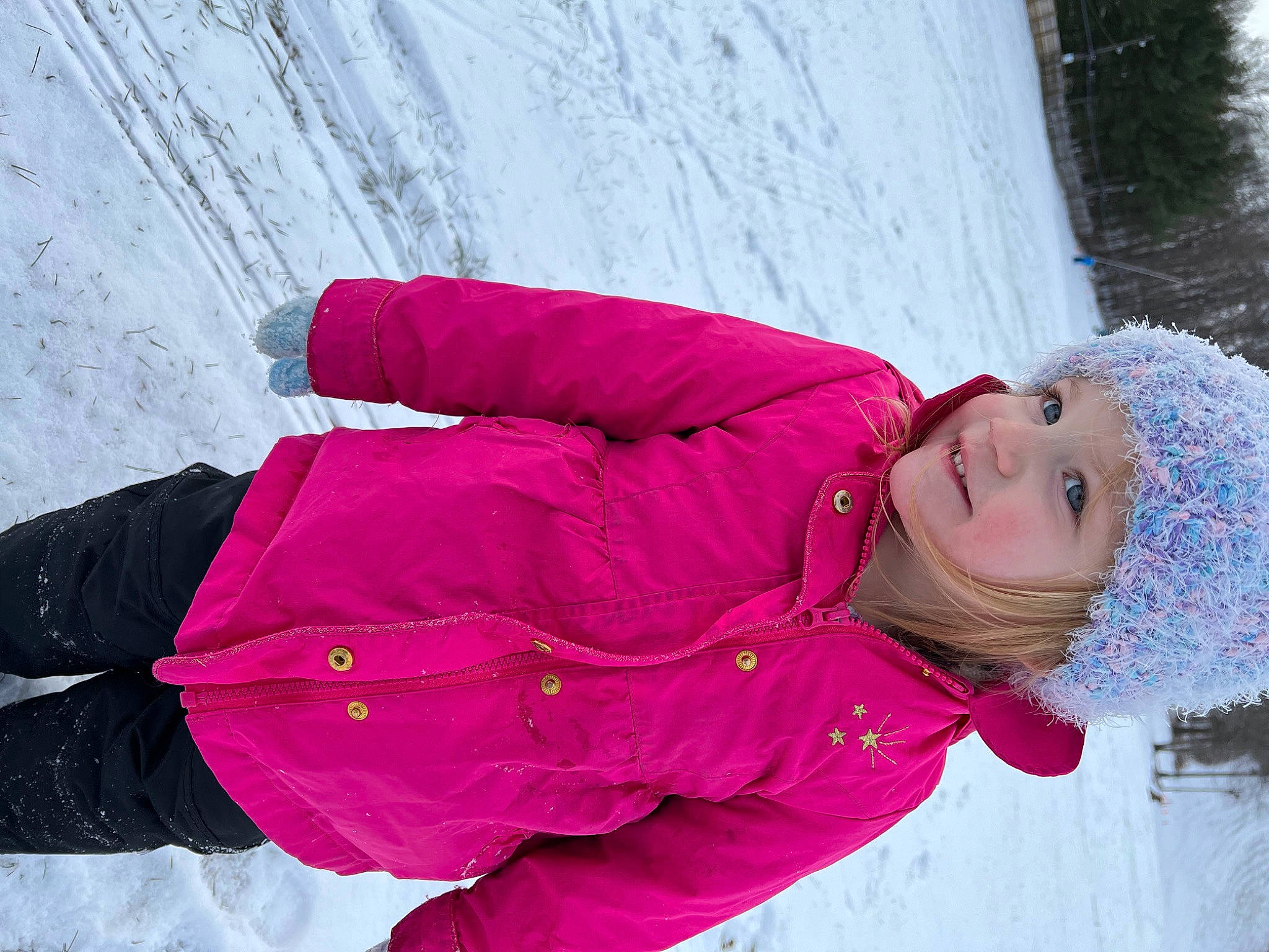 Addisyn is registered to the contest to win money with this photo: child, freezing, fun, glove, happy, headwear, ice_cap, jacket, leisure, magenta, person, pink, playing_in_the_snow, purple, recreation, slope, smile, snow, textile, tree