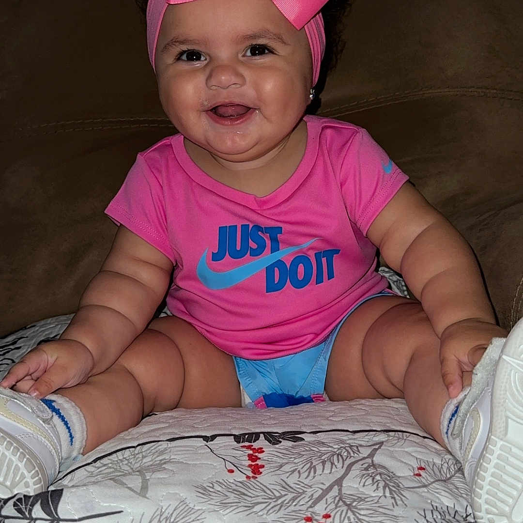 Zanaya joined the competition — help win amazing prizes! baby, bed, cap, clothing, couch, cushion, face, footwear, furniture, happy, hat, head, homedecor, indoors, person, photography, portrait, shoe, shorts, t_shirt