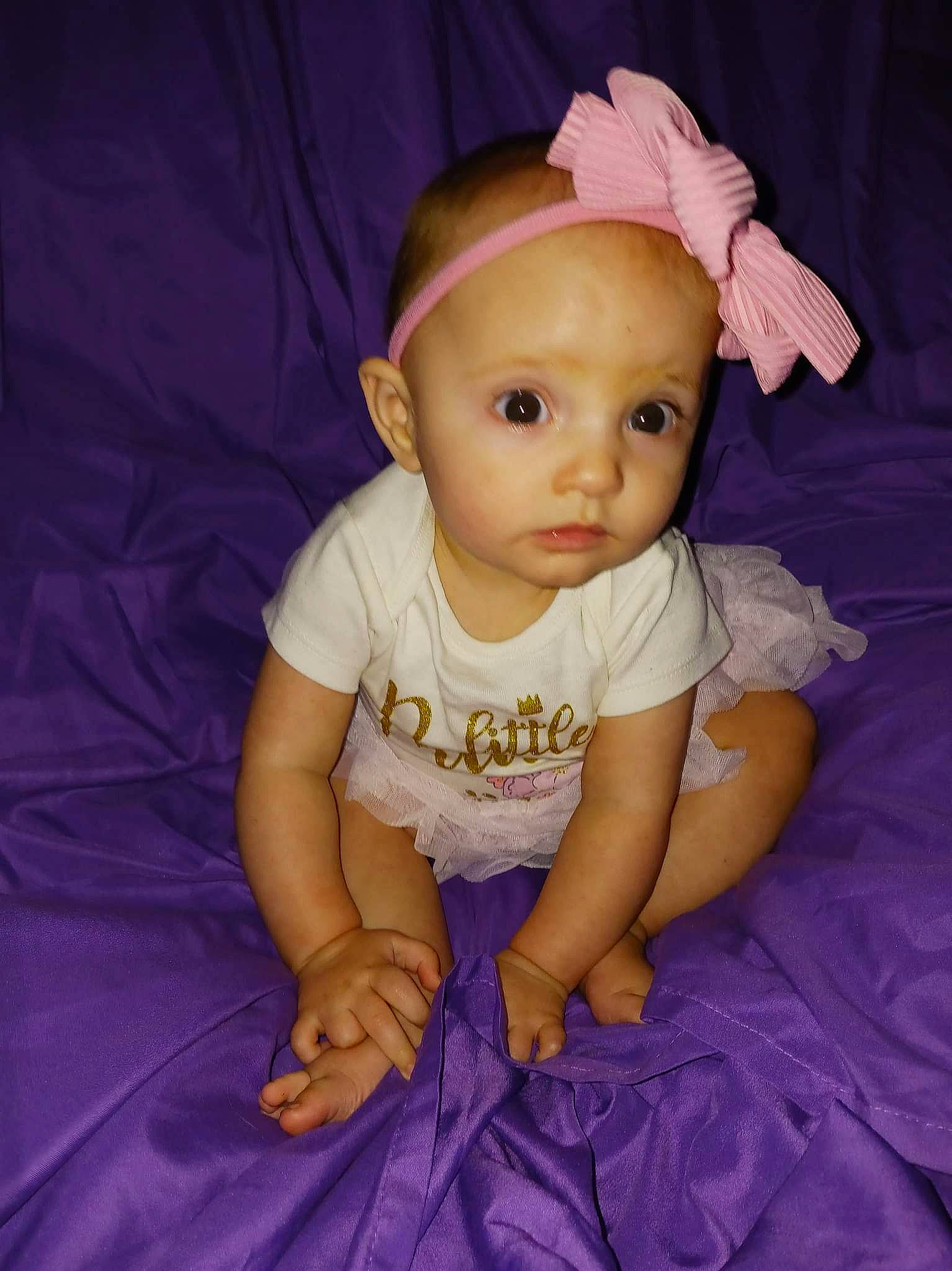 Olive is registered to the contest to win money with this photo: baby, baby_toddler_clothing, cheek, child, electric_blue, face, flash_photography, fun, hairstyle, happy, hat, iris, magenta, person, pink, purple, skin, sleeve, textile, toddler