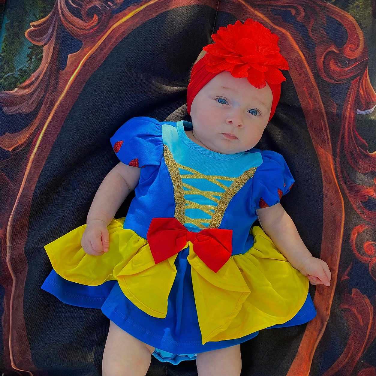 Danilynn is registered to the contest to win money with this photo: baby, bonnet, cap, clothing, cosplay, costume, crib, dress, face, furniture, hat, head, hood, infantbed, pants, person, photography, portrait, toy, velvet
