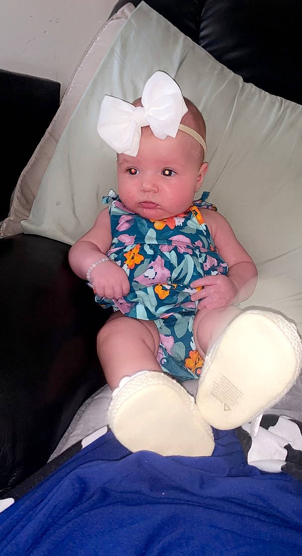 Meadow joined the competition — help win amazing prizes! baby, baby_products, baby_toddler_clothing, child, comfort, costume, costume_hat, fun, headband, headwear, human_leg, knee, lap, pattern, person, pink, purple, sitting, sleeve, sock