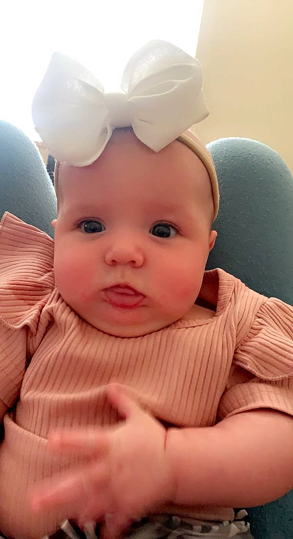 Meadow joined the competition — help win amazing prizes! baby, baby_toddler_clothing, cap, cheek, chin, comfort, eye, eyebrow, eyelash, hair_accessory, happy, head, iris, lip, mouth, nose, person, pink, skin, thumb