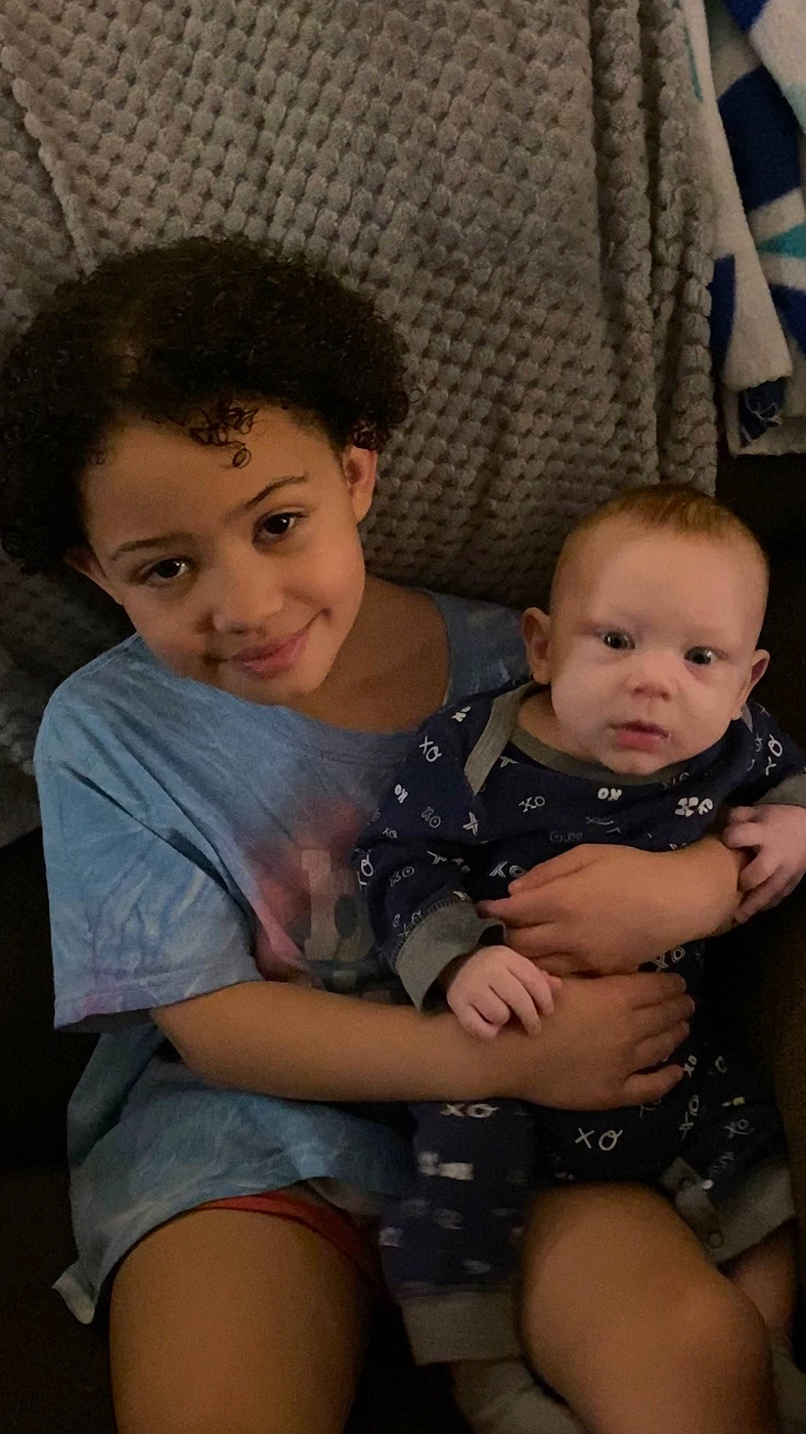 Richard is registered to the contest to win money with this photo: baby, baby_toddler_clothing, cheek, child, comfort, eye, face, facial_expression, fun, hairstyle, happy, head, human, iris, joy, lap, organ, person, skin, thigh