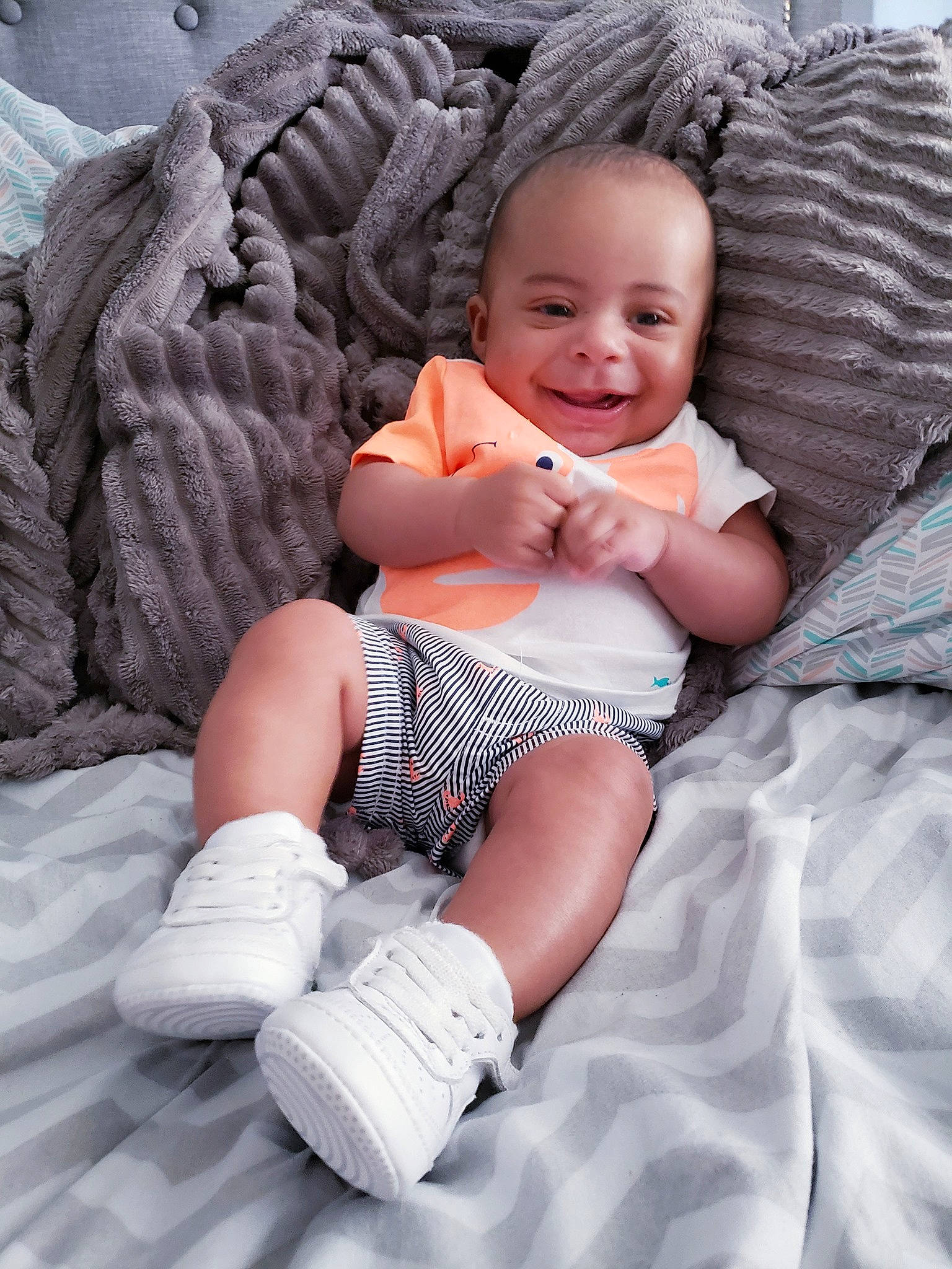 Joziah is registered to the contest to win money with this photo: abdomen, baby, baby_products, baby_toddler_clothing, cheek, child, comfort, human, joy, person, photo_shoot, skin, sock, stomach, toddler