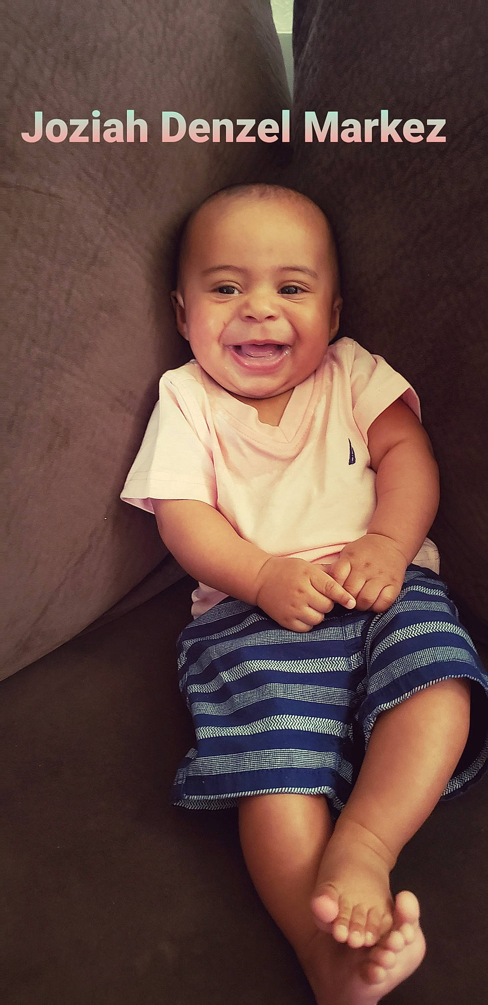 Joziah is registered to the contest to win money with this photo: baby, baby_toddler_clothing, cheek, child, day_dress, eyelash, facial_expression, finger, happy, human_leg, iris, joy, laugh, lip, organ, person, photo_caption, portrait_photography, skin, toddler