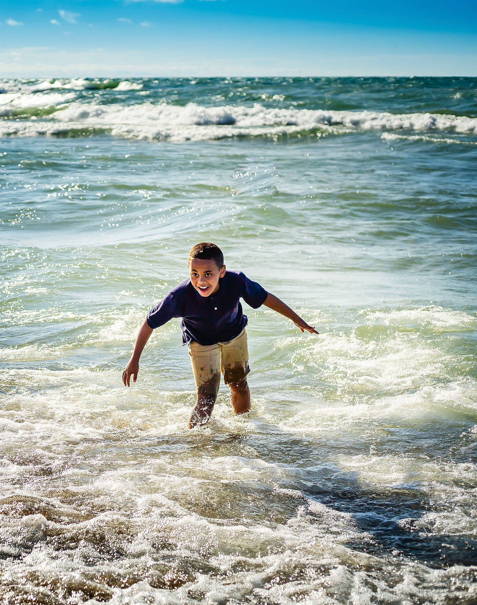 Noah is registered to the contest to win money with this photo: balance, barefoot, beach, foam, holiday, joy, leisure, ocean, people_in_nature, people_on_beach, person, sea, summer, tide, vacation, water, wave, wind, wind_wave