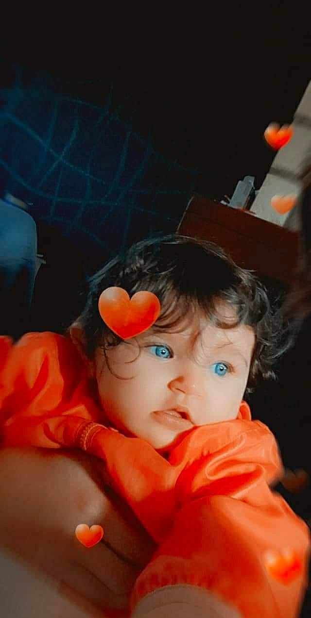 Ynés participe au concours pour gagner de l'argent avec cette photo : baby, cheek, child, nose, orange, person, photography, play, toddler