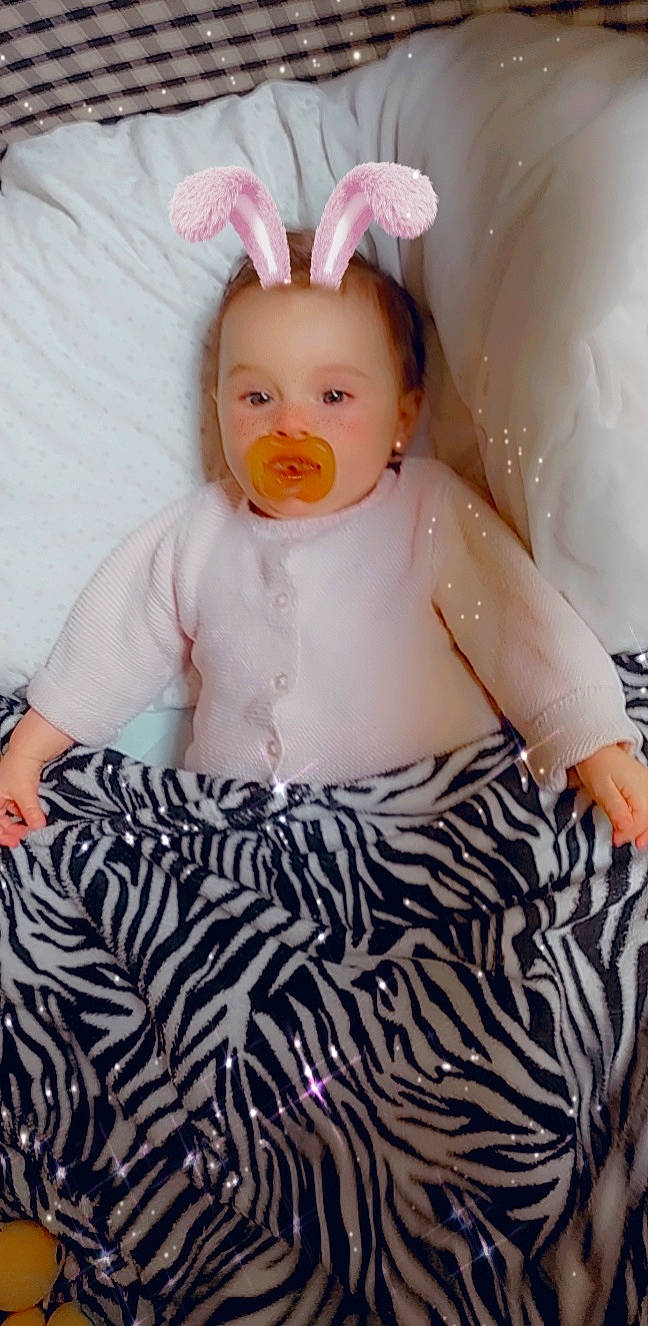 Soraya participe au concours pour gagner de l'argent avec cette photo : baby, baby_toddler_clothing, doll, dress, eye, eyebrow, eyelash, hair, hairstyle, happy, head, iris, person, pink, product, skin, sleeve, textile, toddler, toy