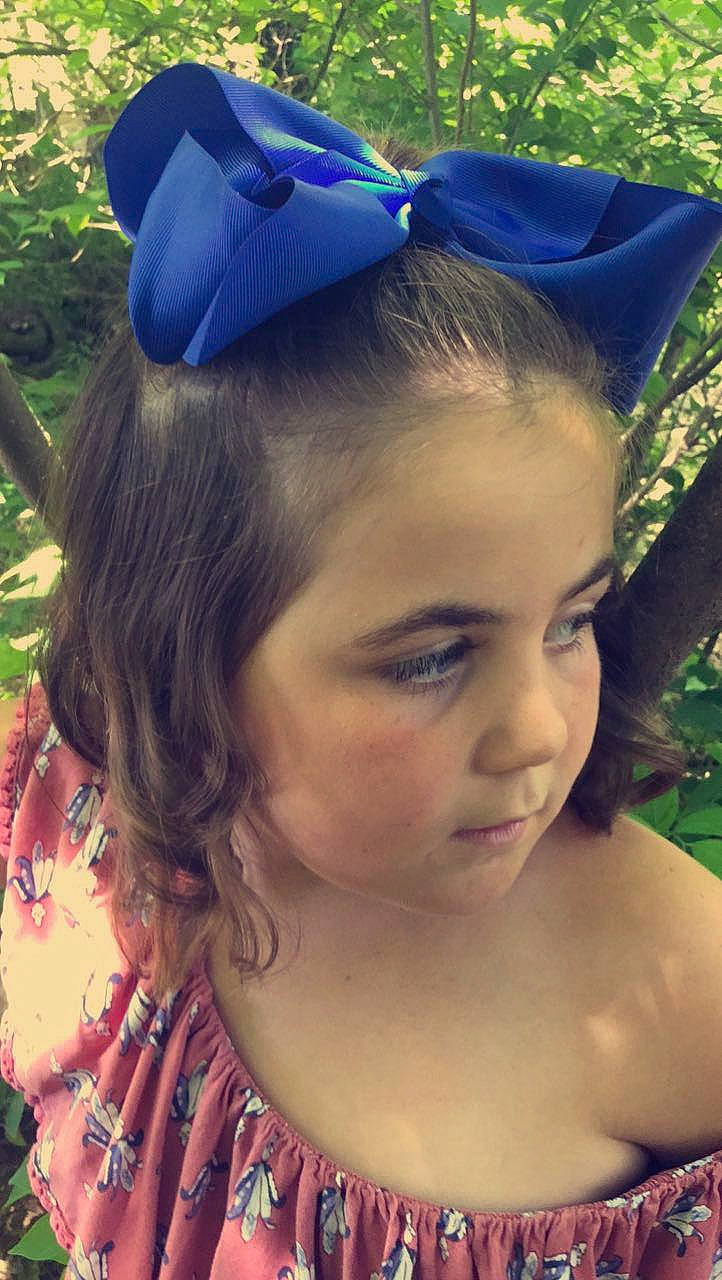 Chelsea is registered to the contest to win money with this photo: beauty, blue, costume_accessory, costume_hat, ear, electric_blue, face, fashion_accessory, forehead, hair, hair_accessory, hairstyle, hat, head, headband, headgear, headpiece, lip, long_hair, person