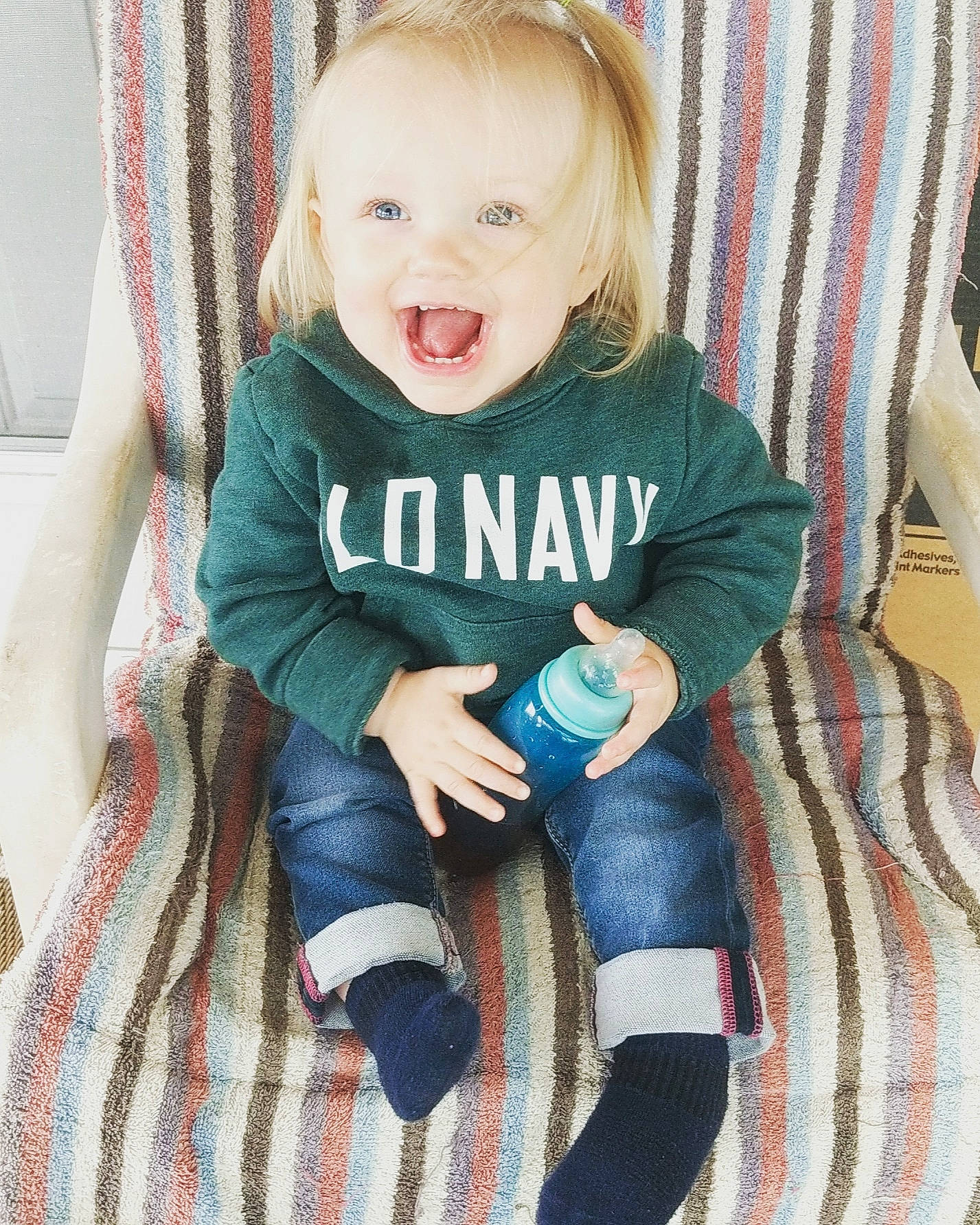 Maggie joined the competition — help win amazing prizes! arm, baby, baby_toddler_clothing, child, comfort, couch, eye, face, hairstyle, hand, happy, head, iris, knee, person, sleeve, smile, sock, t_shirt, textile