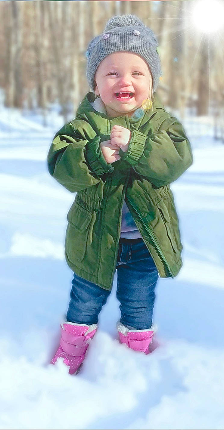 Maggie joined the competition — help win amazing prizes! baby_toddler_clothing, child, facial_expression, freezing, fun, gesture, grass, happy, headwear, jacket, jeans, joy, leisure, people_in_nature, person, sleeve, smile, snow, standing, toddler