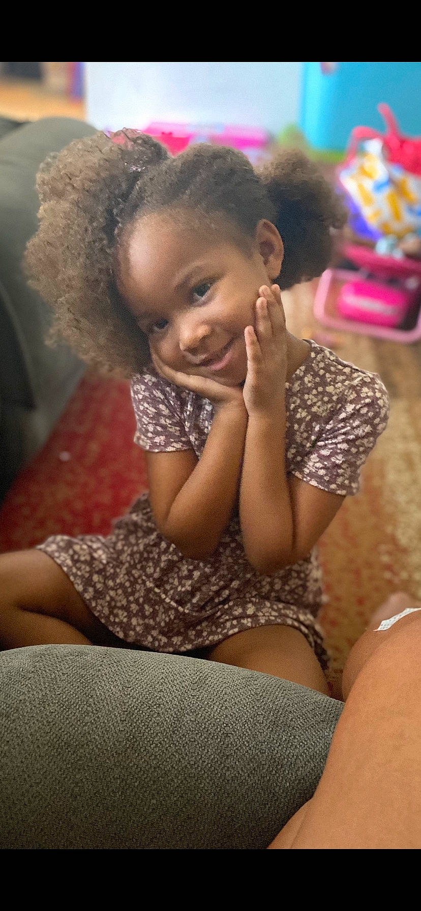 Eliza joined the competition — help win amazing prizes! afro, black_hair, child, comfort, fun, hair, hairstyle, happy, human_leg, joy, knee, leisure, long_hair, mouth, person, pink, room, sitting, skin, smile
