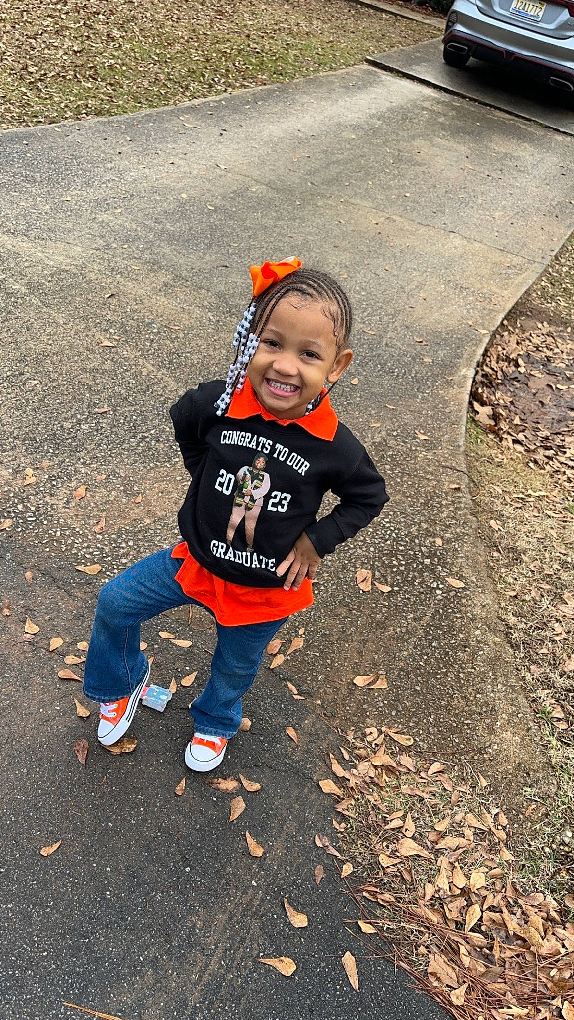 Haleigh is registered to the contest to win money with this photo: asphalt, automotive_tire, deciduous, fun, grass, happy, jeans, joy, landscape, leisure, people_in_nature, person, personal_protective_equipment, recreation, road_surface, shadow, sidewalk, smile, soil, t_shirt