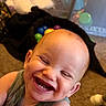 Aemond is registered to the contest to win money with this photo: baby, smile, teeth, happy, face, child, indoor, carpet, toys, colorful, close_up, head, person, mouth, skin, cheeks, infant, clothing, play, fun