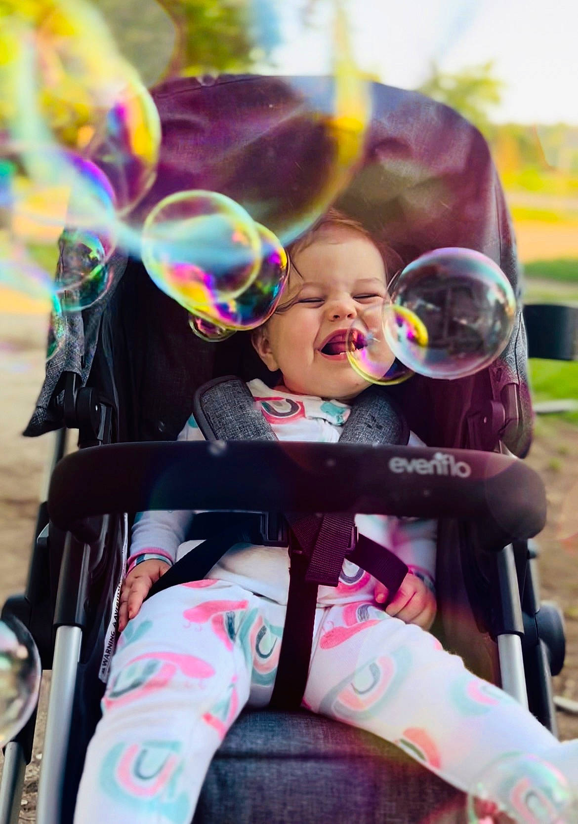 Teagan joined the competition — help win amazing prizes! baby, baby_carriage, baby_products, child, cool, eyewear, facial_expression, fun, grass, happy, human, leisure, person, pink, product, recreation, skin, smile, sunglasses, sunlight