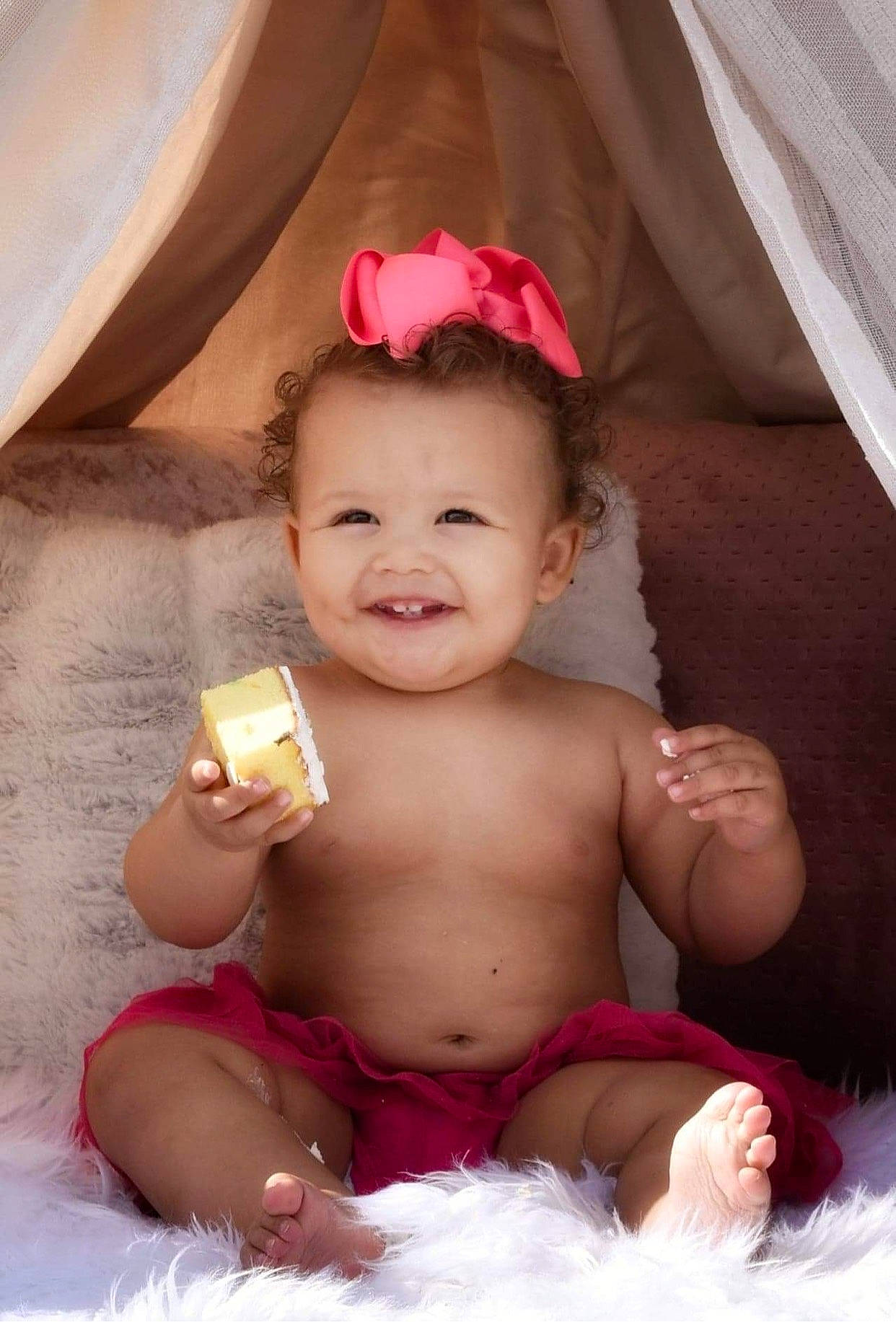 Brionna is registered to the contest to win money with this photo: baby, cheek, chin, eye, eyebrow, eyelash, facial_expression, finger, flash_photography, happy, headgear, human_body, joy, lip, mouth, neck, person, pink, skin, smile