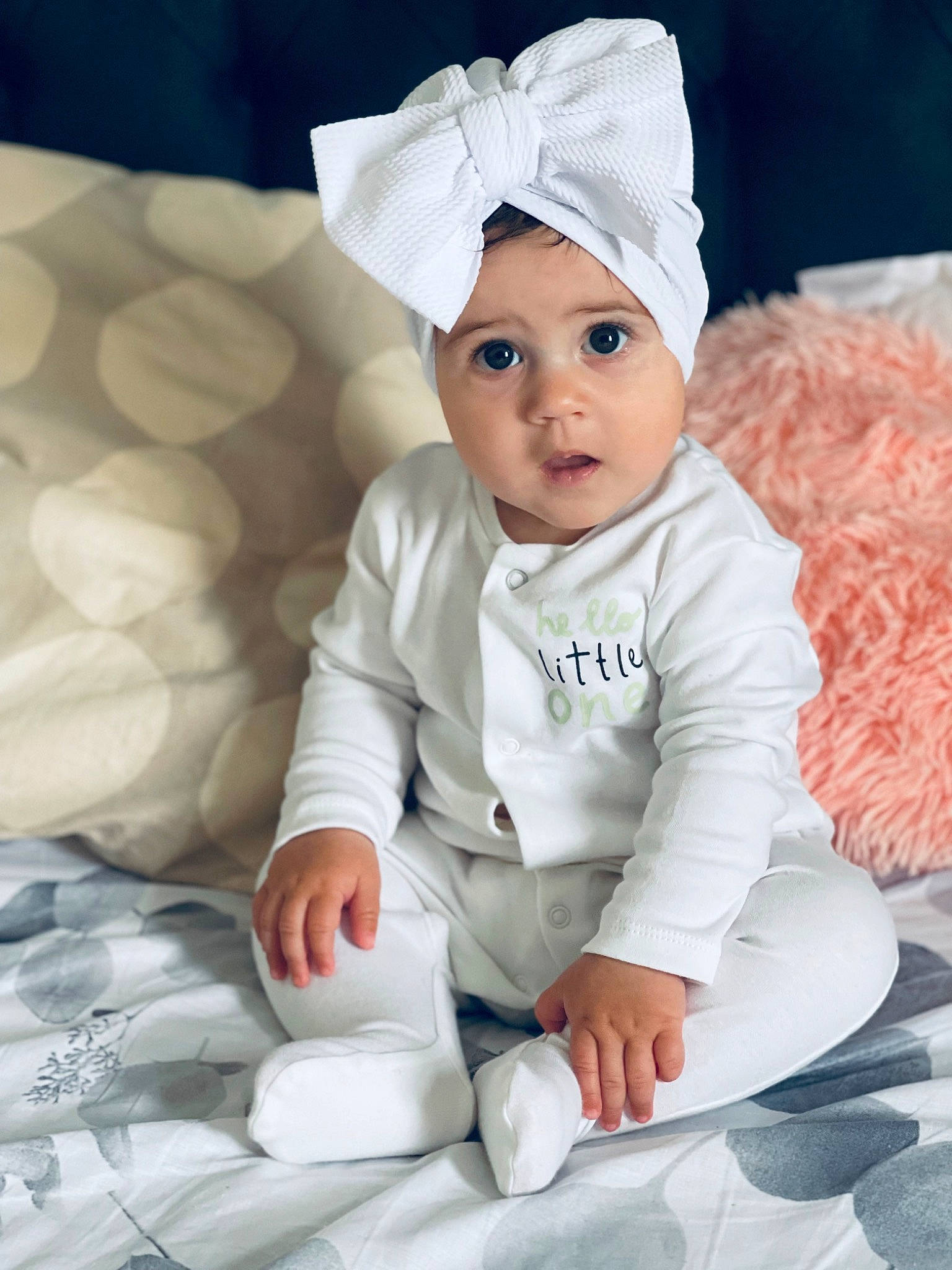 Melania joined the competition — help win amazing prizes! baby, baby_toddler_clothing, cap, cheek, child, comfort, costume_hat, event, fictional_character, fun, gesture, grass, happy, headwear, human_body, linens, person, sitting, skin, sleeve