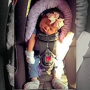 Izabelle joined the competition — help win amazing prizes! baby, infant, child, sleeping, car_seat, seatbelt, bow, headband, socks, pacifier, vehicle, travel, sunlight, portrait, close_up, color_photo, black_and_white, cozy, safe, seated