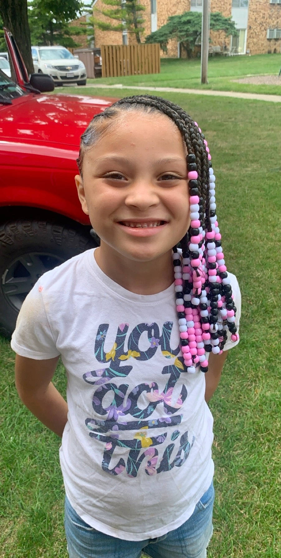 Kaaliyah is registered to the contest to win money with this photo: active_shirt, alloy_wheel, auto_part, automotive_tire, baby_toddler_clothing, braid, cornrows, dreadlocks, fender, hairstyle, happy, hubcap, joy, lip, mouth, person, smile, style, tire_care, tooth