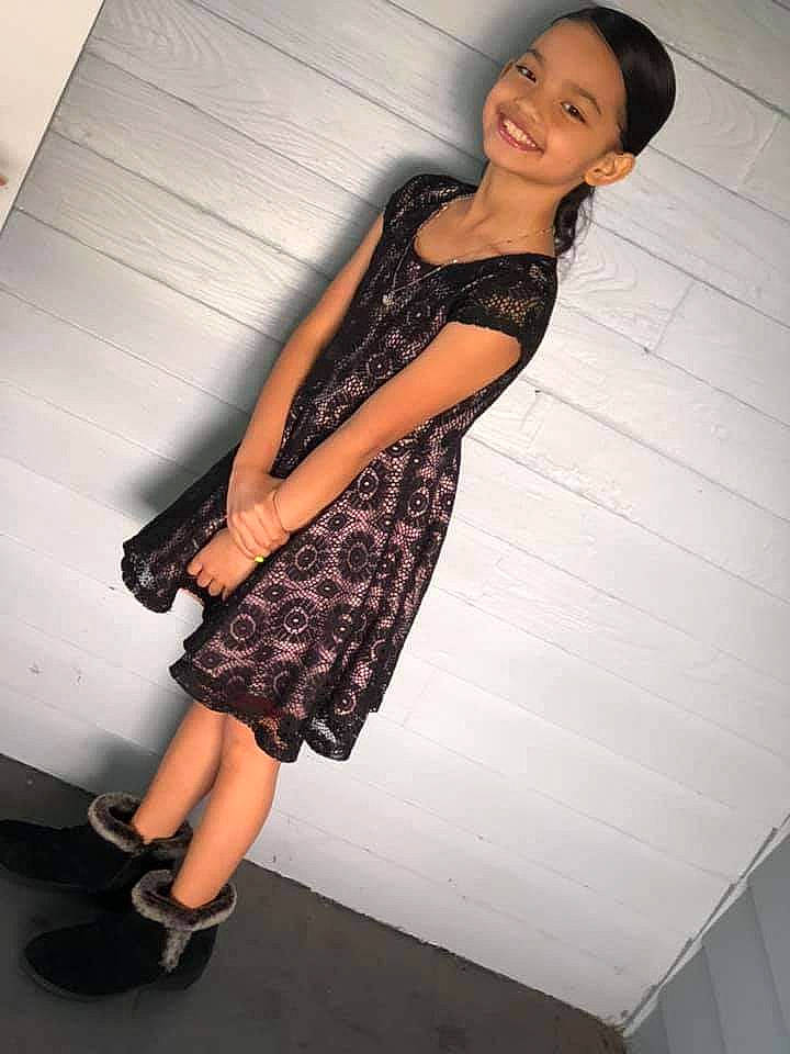 Trina is registered to the contest to win money with this photo: automotive_design, black_hair, day_dress, dress, fashion_design, flash_photography, flooring, formal_wear, hairstyle, human_body, human_leg, joint, joy, knee, one_piece_garment, person, shoe, shoulder, smile, street_fashion