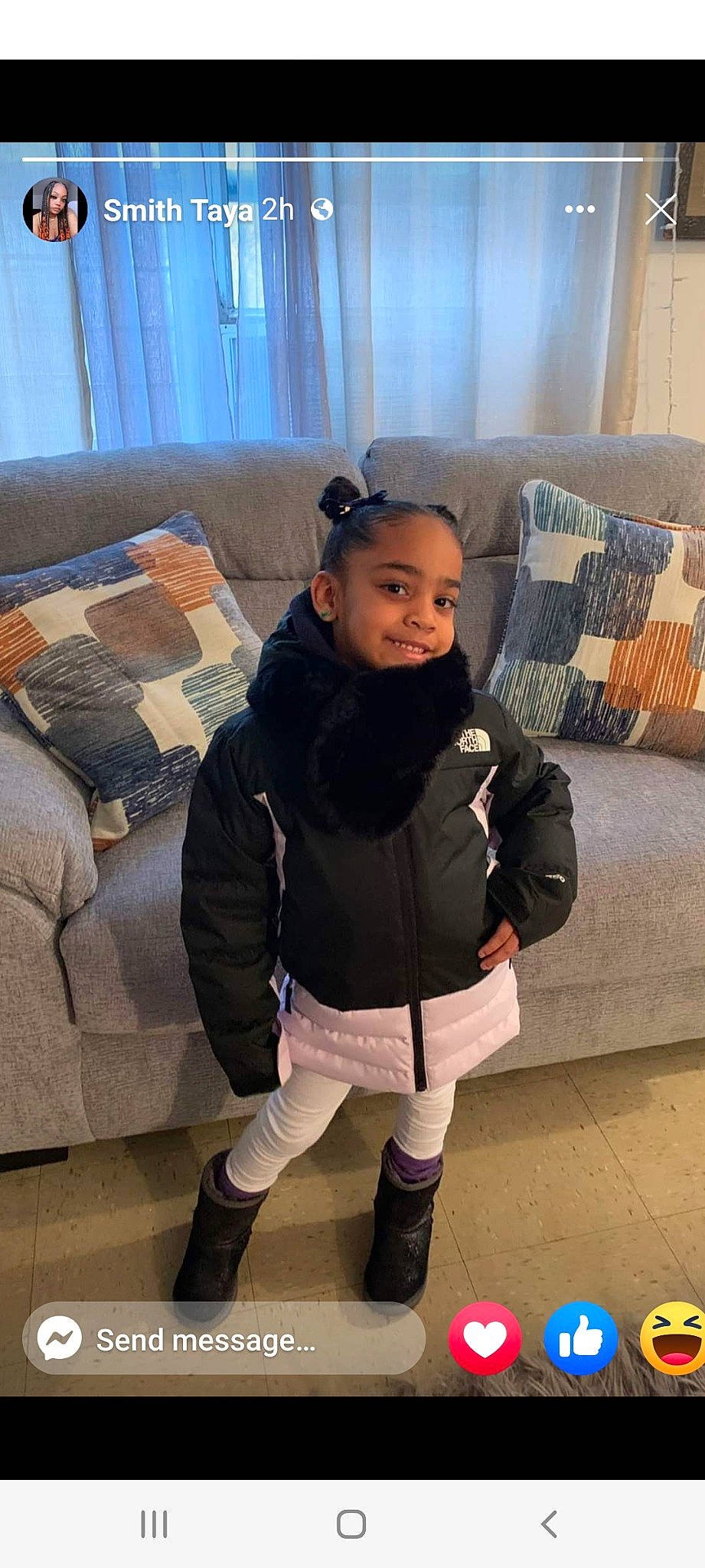 Elani is registered to the contest to win money with this photo: child, comfort, couch, eye, floor, flooring, happy, human_leg, jacket, joy, knee, leg, outerwear, person, shoulder, skin, sleeve, sock, sportswear, textile