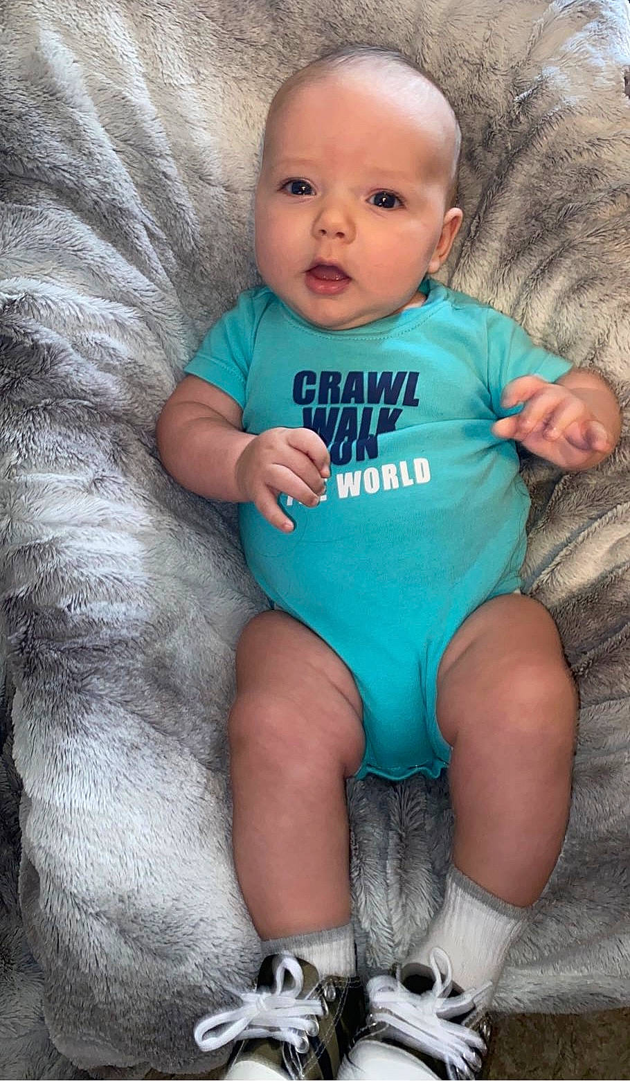 Jaxson is registered to the contest to win money with this photo: arm, azure, baby, baby_toddler_clothing, comfort, eye, finger, grey, happy, human, iris, leg, mammal, organ, person, skin, sleeve, stomach, textile, toddler