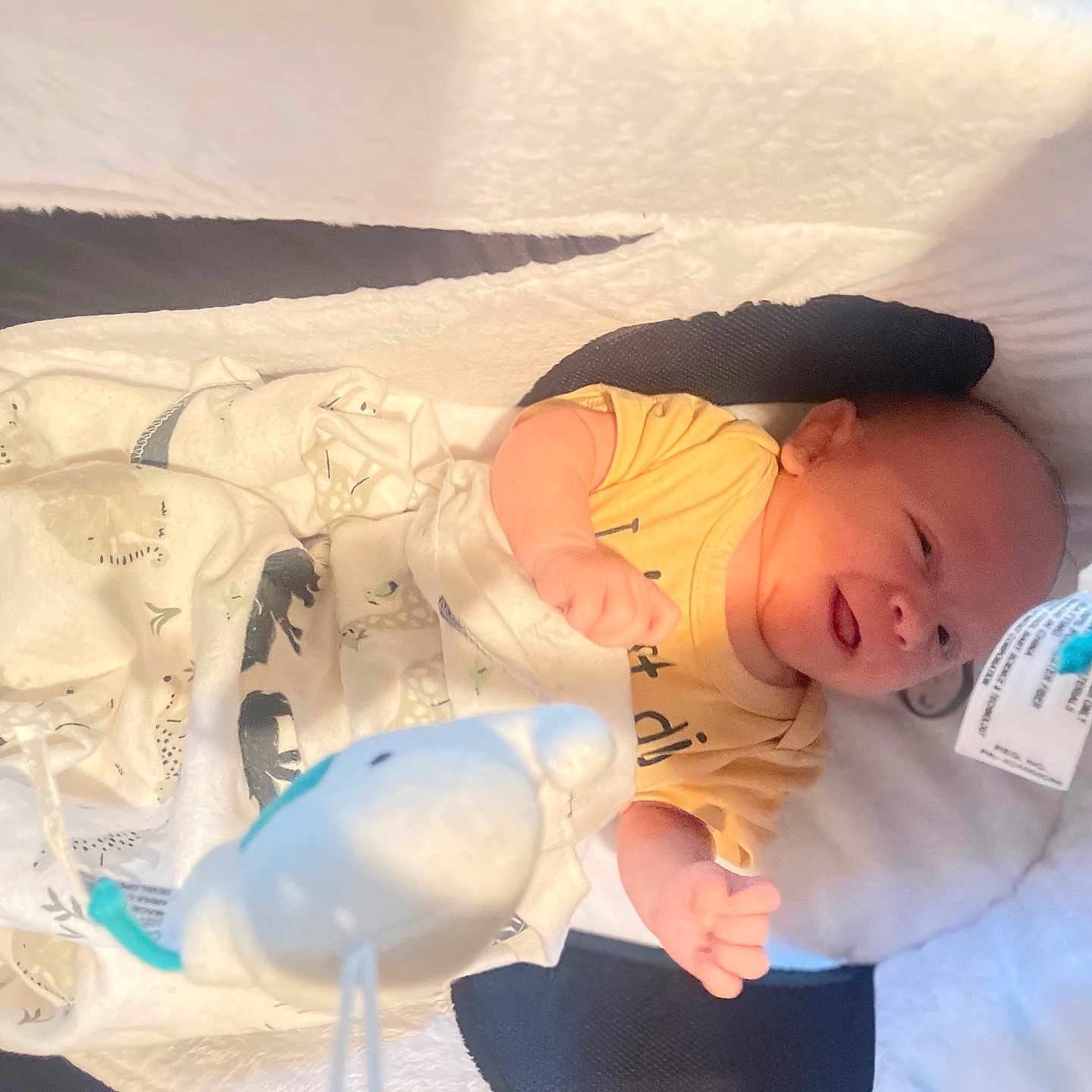 James is registered to the contest to win money with this photo: architecture, baby, bed, blanket, building, clothing, crying, cushion, face, furniture, glove, head, homedecor, hospital, newborn, person, photography, portrait, sad, sleeping