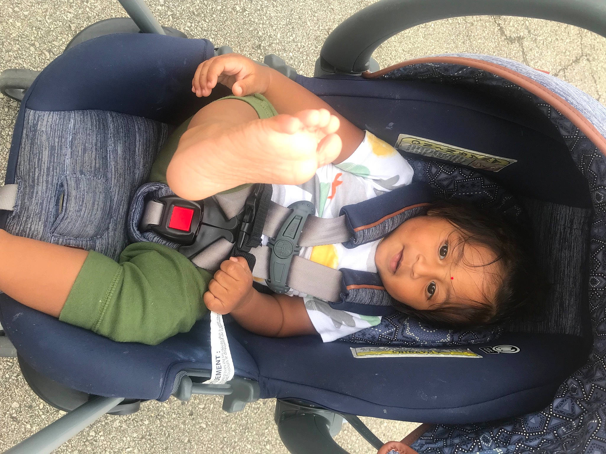 Rithvik is registered to the contest to win money with this photo: arm, automotive_design, automotive_tire, bag, black_hair, comfort, cool, elbow, eyewear, finger, fun, gesture, hairstyle, knee, motor_vehicle, mouth, person, product, thigh, vehicle_door