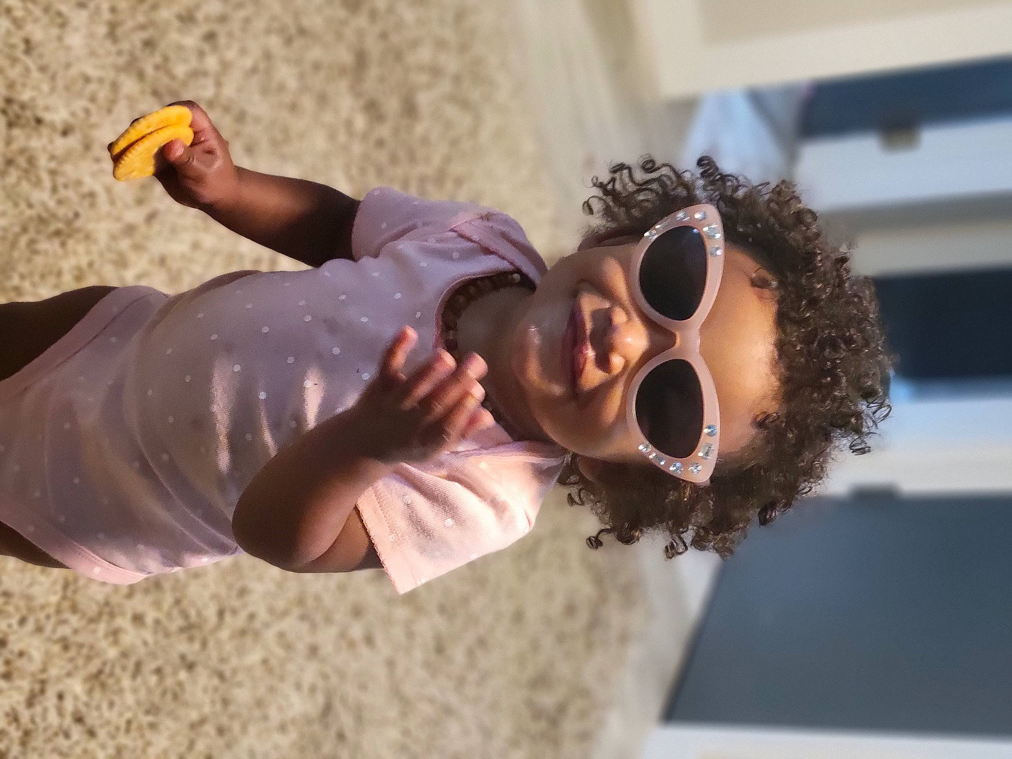 Ensley is registered to the contest to win money with this photo: audio_equipment, child, entertainment, event, eyewear, facial_hair, fun, gesture, happy, leisure, performance, person, recreation, soil, sunglasses, vacation