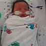 newborn, baby, hospital, medical_tube, blanket, sleeping, face, infant, swaddled, healthcare, medical_equipment, bed, cute, child, pediatric, peaceful, tubes, person, resting, healthcare_environment