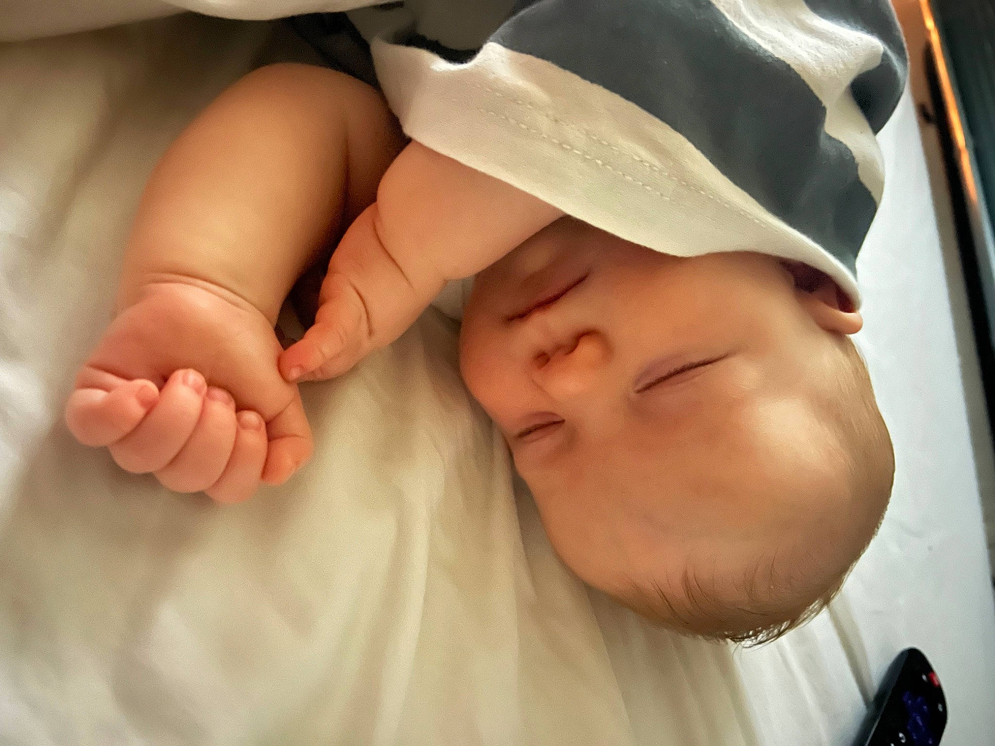 Bjorn is registered to the contest to win money with this photo: baby, baby_toddler_clothing, cap, child, close_up, comfort, eyelash, finger, foot, gesture, happy, hat, kitchen_utensil, mobile_phone, nail, person, skin, smile, thumb, toddler